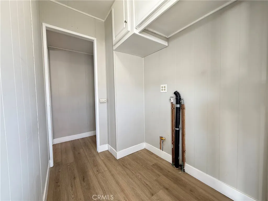 716 North Grand, Unit F8 Covina, CA 91724 - Photo 8 of 21 a view of a hallway with wooden floor