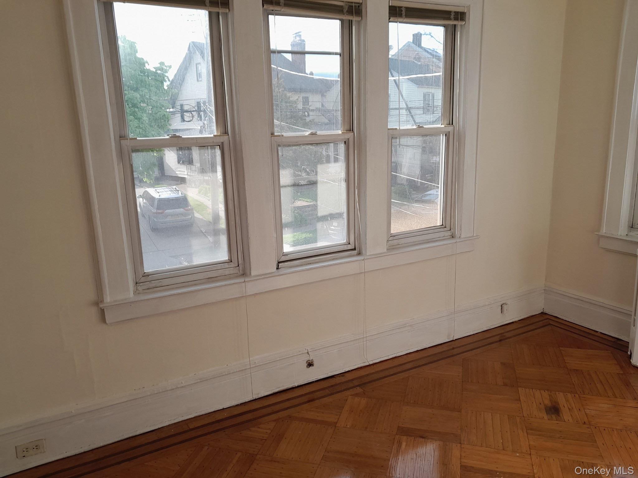 159-32 Normal Road, Unit 2 Queens, NY 11432 - Photo 2 of 13 a view of an empty room with a window