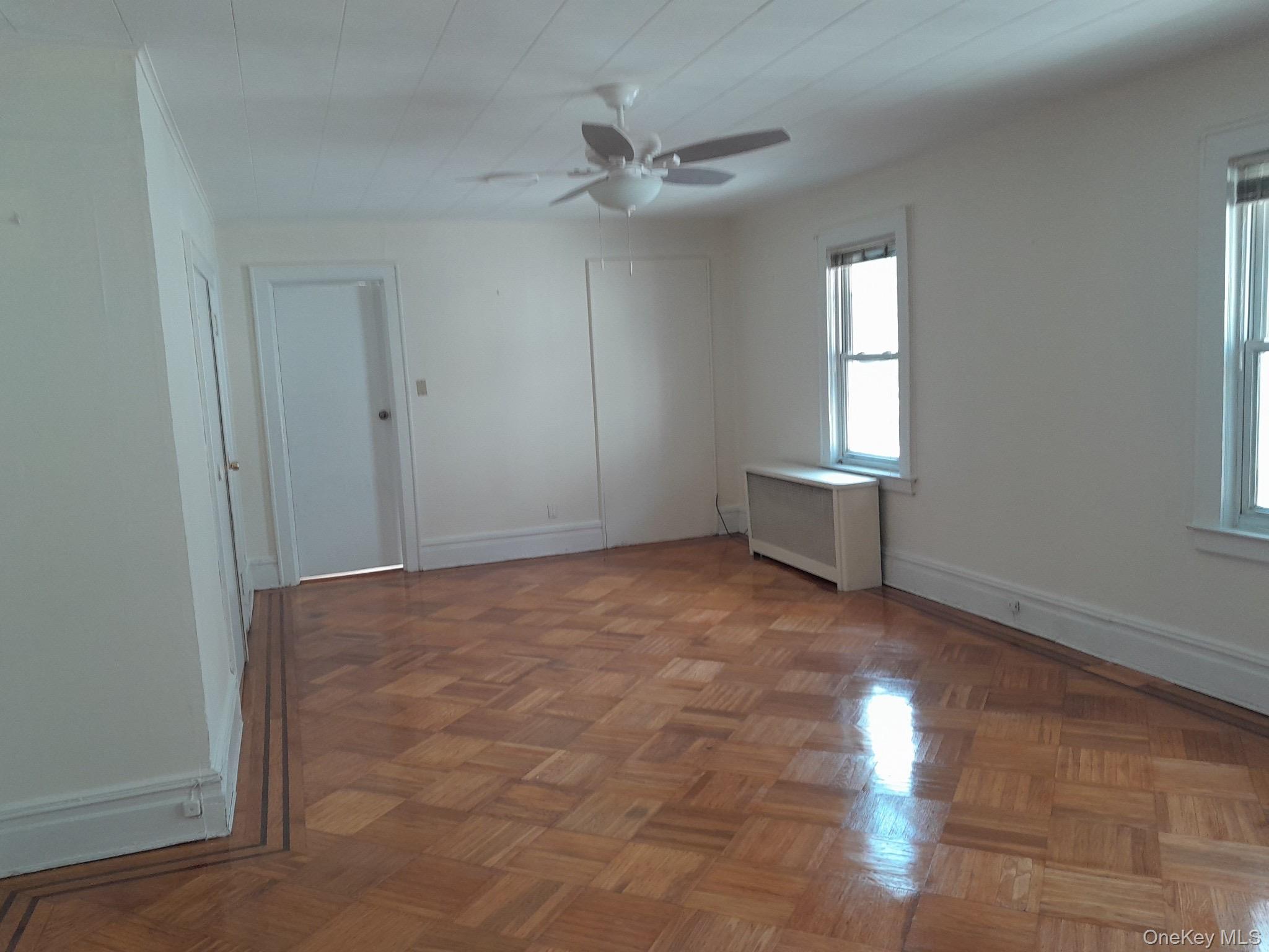 159-32 Normal Road, Unit 2 Queens, NY 11432 - Photo 3 of 13 a view of an empty room with a window