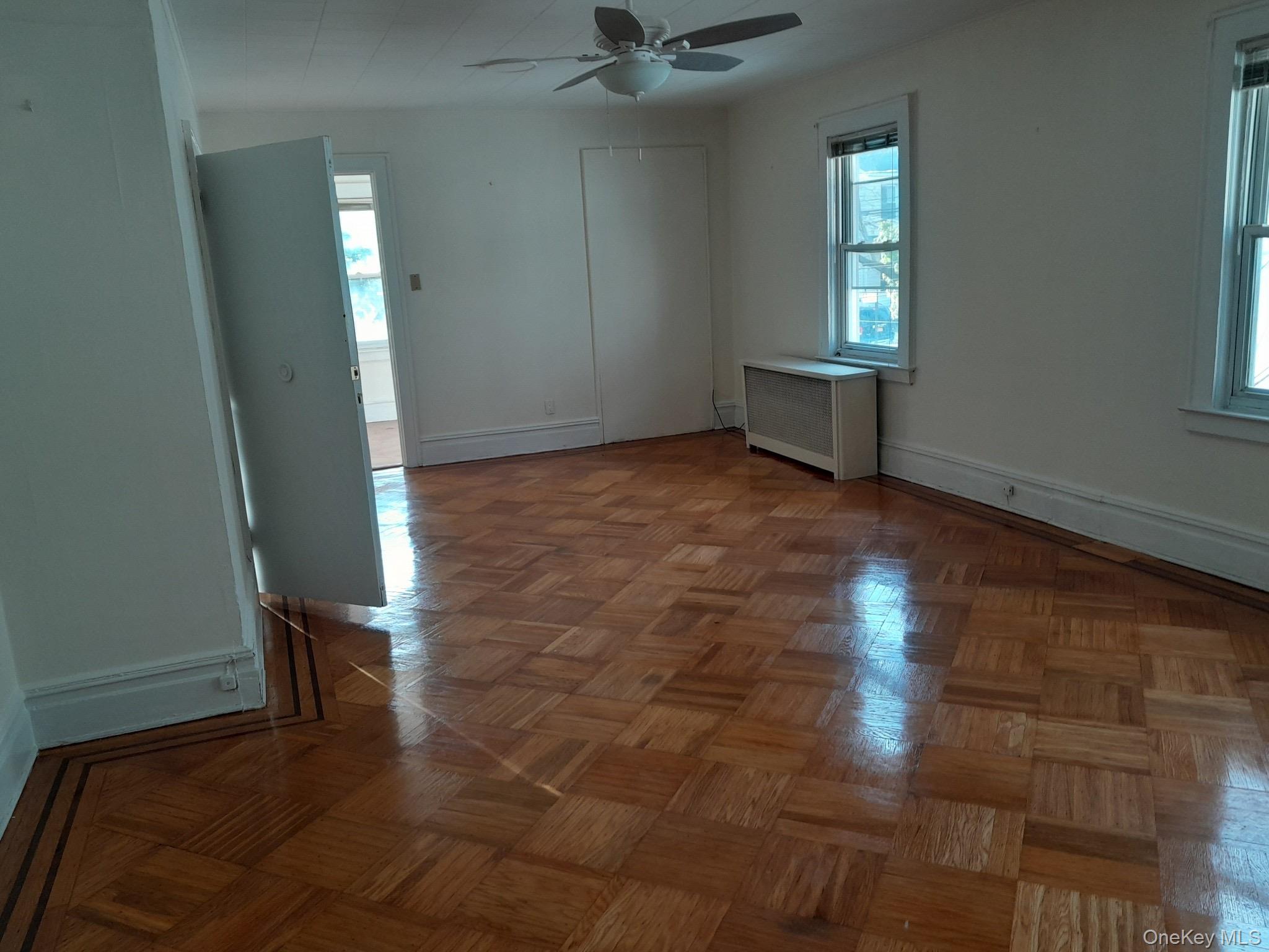 159-32 Normal Road, Unit 2 Queens, NY 11432 - Photo 6 of 13 a view of an empty room with a window