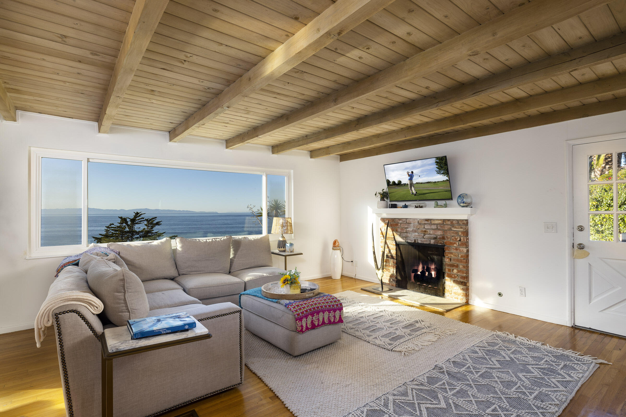 1919 El Camino De La Luz Santa Barbara, CA 93109 - Photo 15 of 28 a living room with furniture and a fireplace