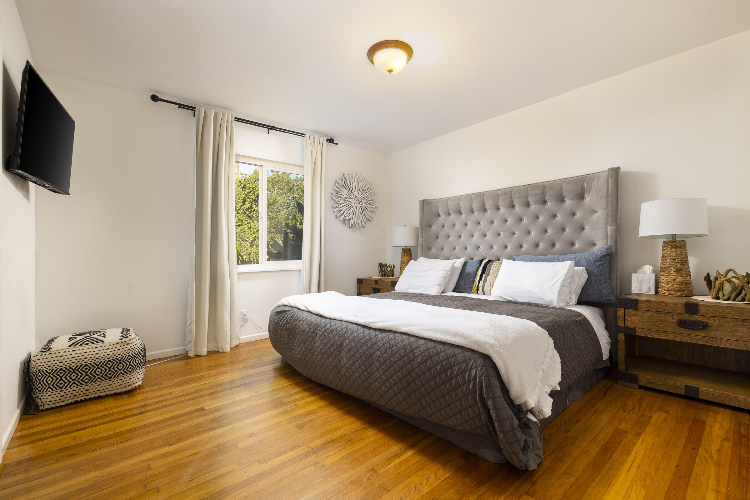 1919 El Camino De La Luz Santa Barbara, CA 93109 - Photo 20 of 28 a bedroom with a bed and a tv