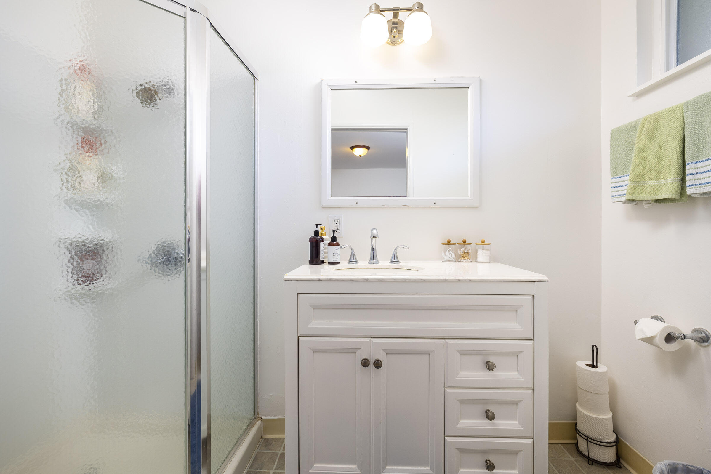 1919 El Camino De La Luz Santa Barbara, CA 93109 - Photo 21 of 28 a bathroom with a sink and a mirror