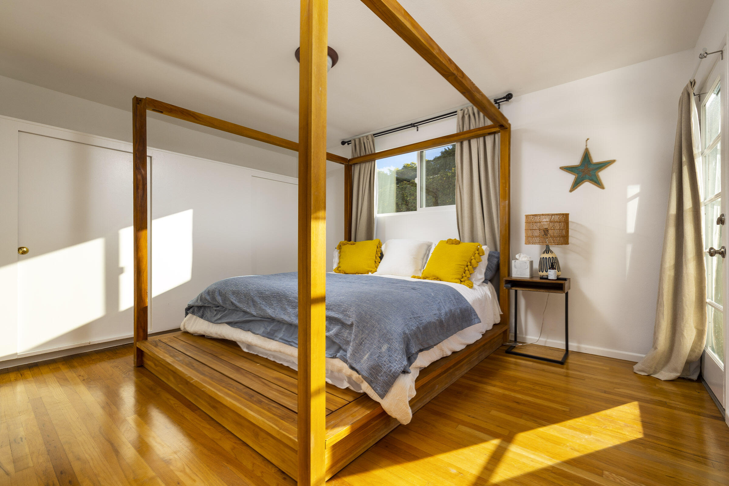 1919 El Camino De La Luz Santa Barbara, CA 93109 - Photo 22 of 28 a bedroom with a bed and wooden floor