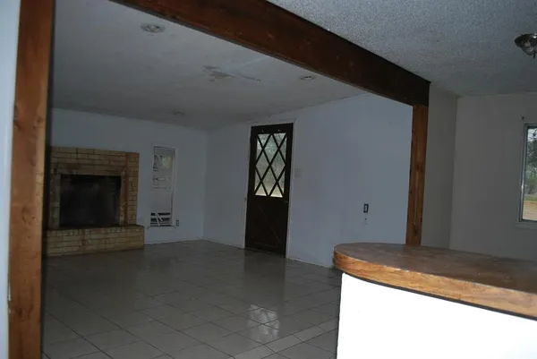 a kitchen with a sink a stove and cabinets