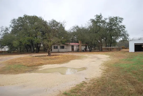 a house with trees in front of it