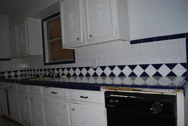 a kitchen with a sink and cabinets