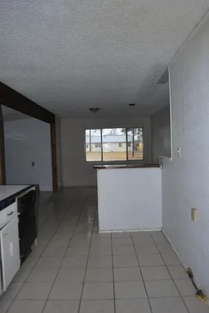 a kitchen with a cabinets and window