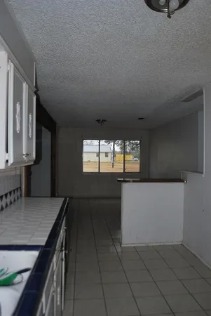 a view of livingroom with washer and dryer