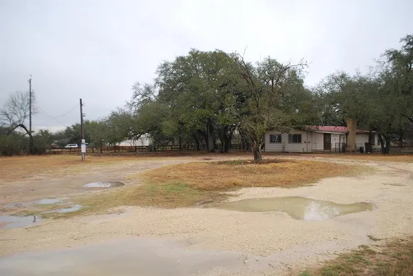 a view of a swimming pool with a yard