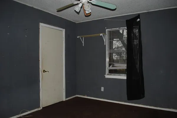 a bathroom with a toilet and a bathtub