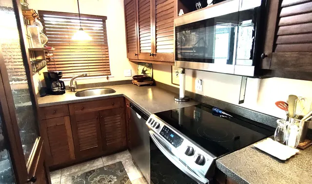 a kitchen with a sink and a stove