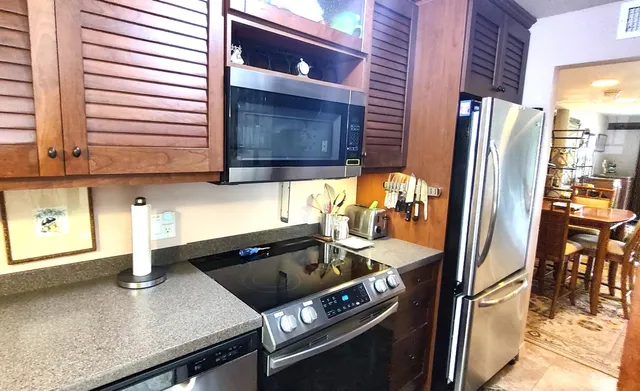 a kitchen with a sink and a stove top oven