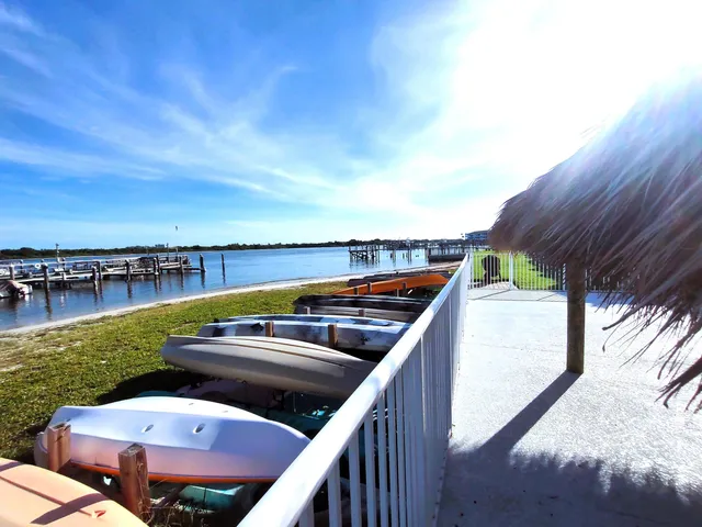 a view of a chairs and table in the balcony