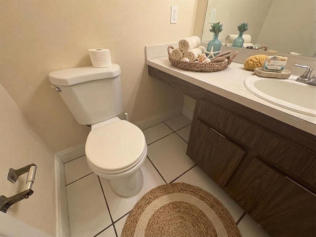 4033 Henley Road, Unit 1707 Orlando, FL 32839 - Photo 16 of 66 a bathroom with a sink and a toilet