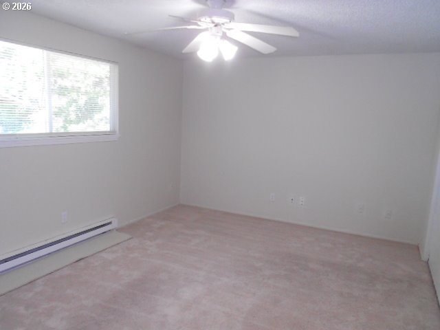 17165 Southwest Merlo Road Beaverton, OR 97003 - Photo 15 of 19 an empty room with a window and a fan