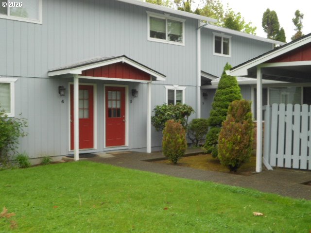 17165 Southwest Merlo Road Beaverton, OR 97003 - Photo 2 of 19 a view of a house with backyard and garden