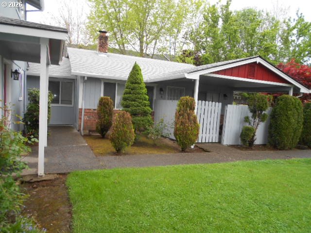 17165 Southwest Merlo Road Beaverton, OR 97003 - Photo 3 of 19 a view of a house with backyard and porch