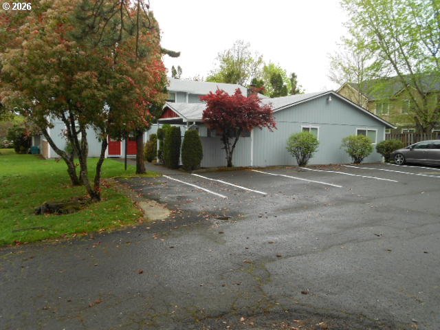 17165 Southwest Merlo Road Beaverton, OR 97003 - Photo 5 of 19 a front view of a house with a yard and garage