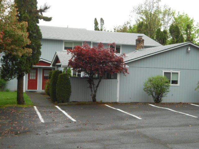 17165 Southwest Merlo Road Beaverton, OR 97003 - Photo 6 of 19 a view of a house with a yard and garage