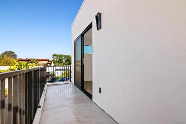 a view of a balcony with wooden floor