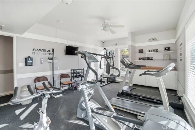 a view of a swimming pool with outdoor seating