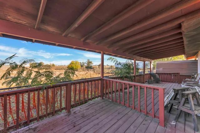 a view of a balcony with wooden floor