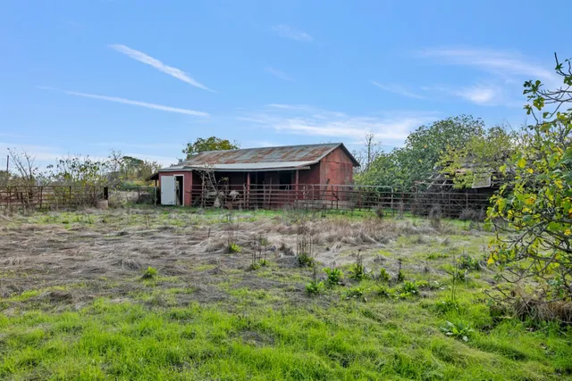 a view of a yard with an outdoor space