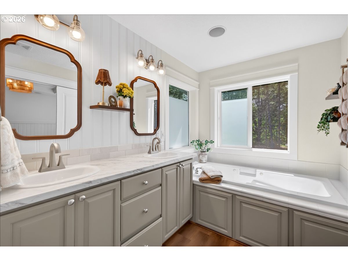 28311 Northwest Nowakowski Road Buxton, OR 97109 - Photo 27 of 48 a bathroom with a double vanity sink and a mirror