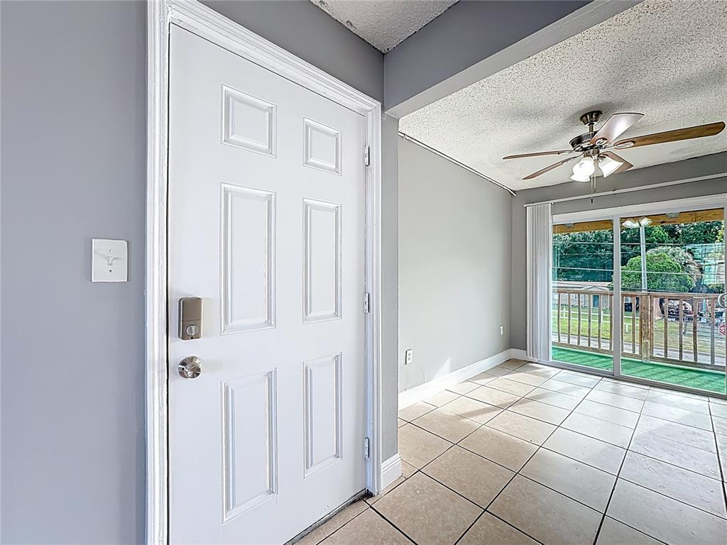 2753 L B McLeod Road, Unit D Orlando, FL 32805 - Photo 10 of 48 a view of a livingroom with a ceiling fan