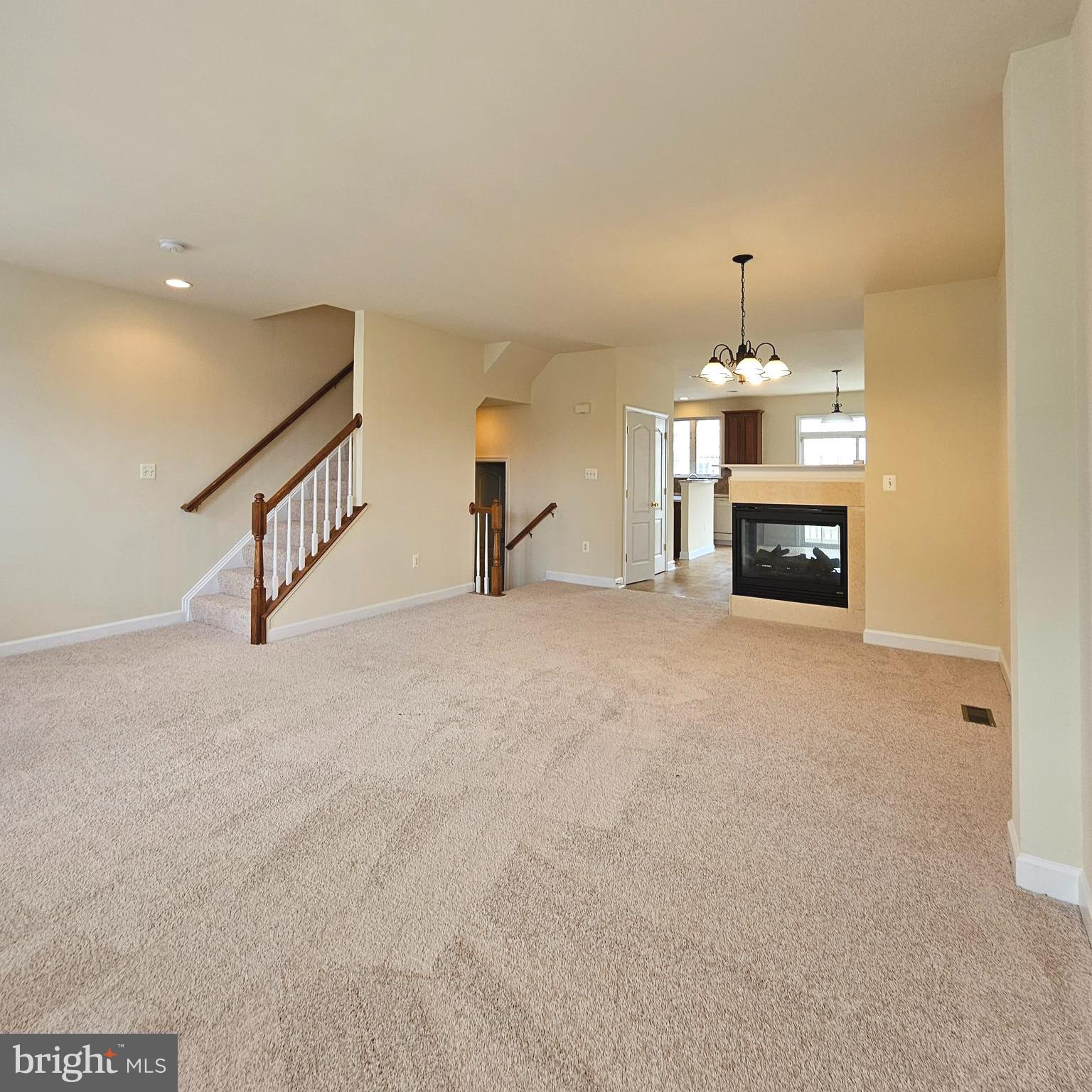 725 Chevington Court Woodbridge, VA 22191 - Photo 12 of 36 a view of a livingroom with fireplace and window