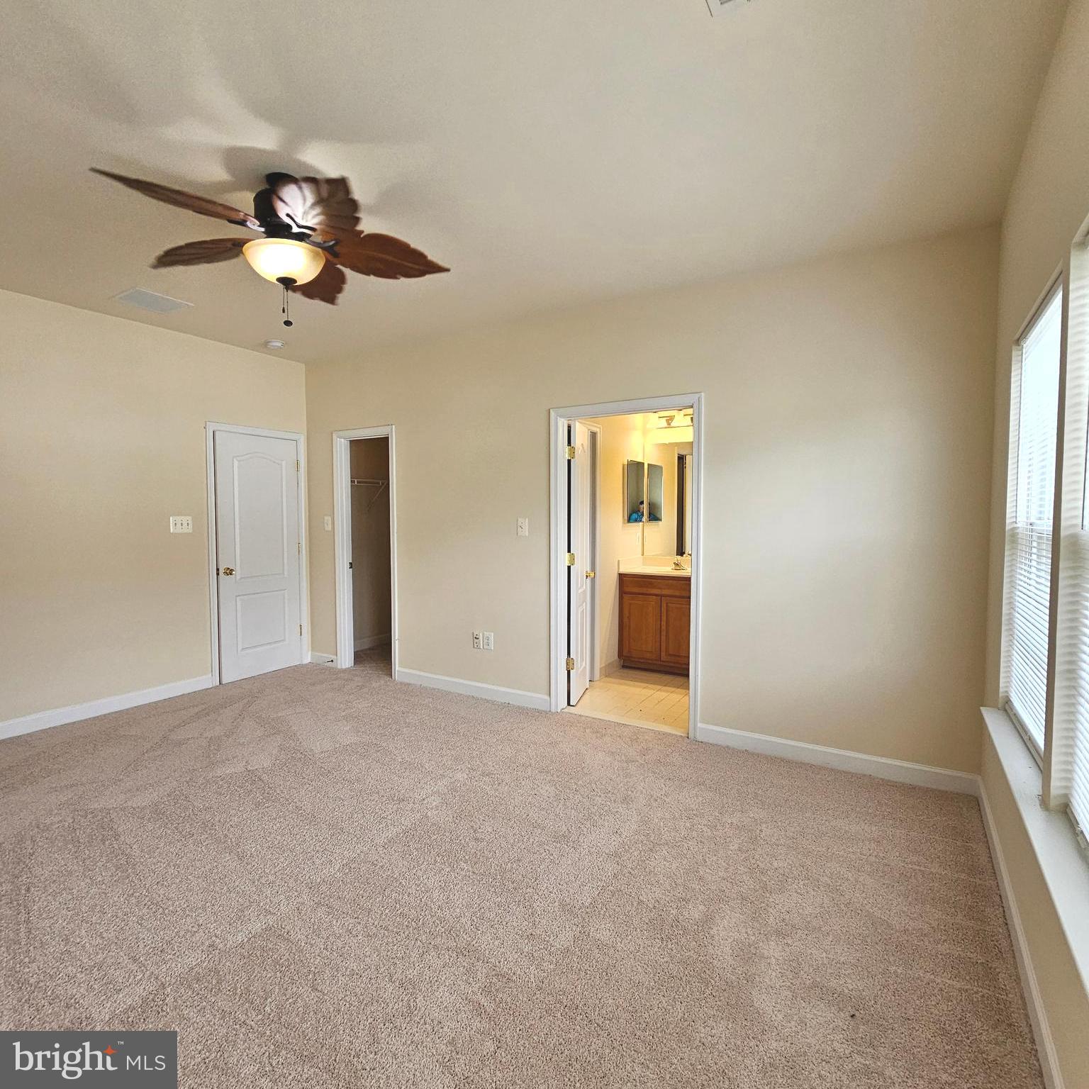 725 Chevington Court Woodbridge, VA 22191 - Photo 25 of 36 an empty room with windows and cabinet