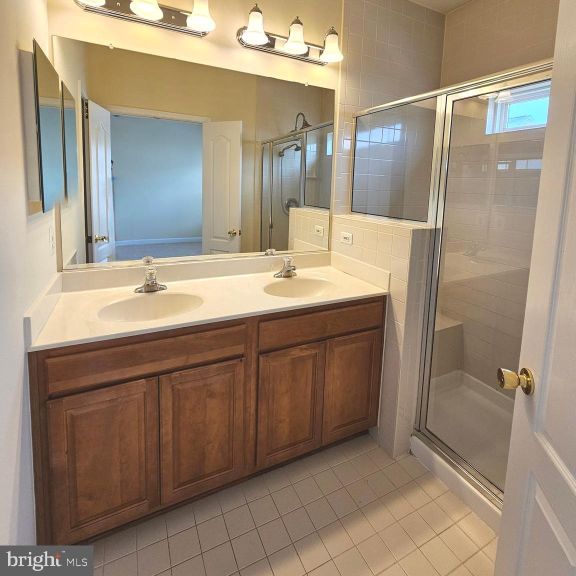 725 Chevington Court Woodbridge, VA 22191 - Photo 26 of 36 a bathroom with a sink and a mirror