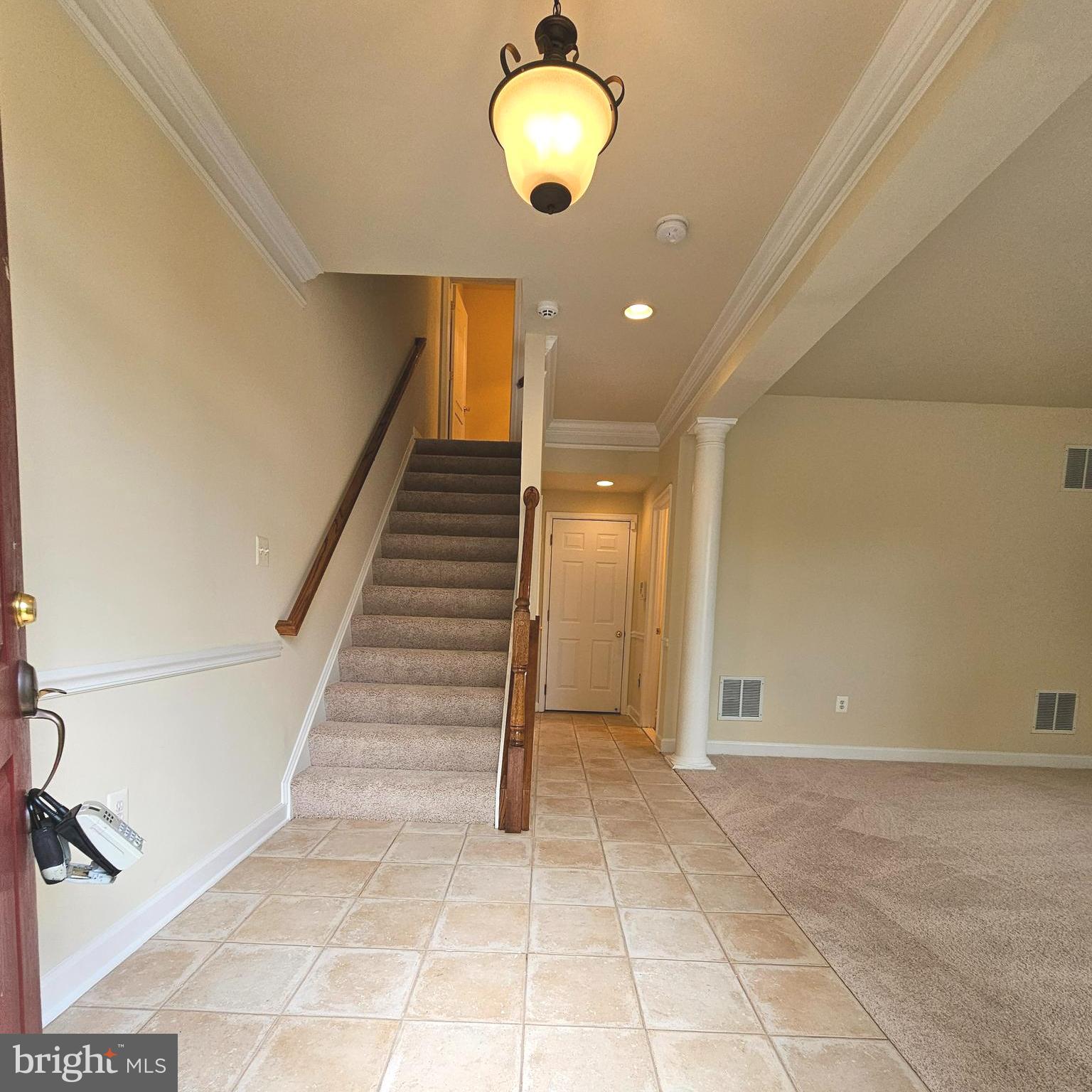 725 Chevington Court Woodbridge, VA 22191 - Photo 3 of 36 a view of entryway and hall with a chair