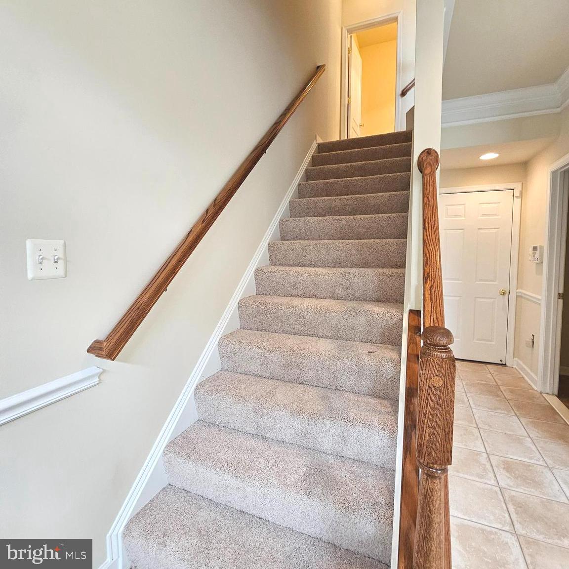 725 Chevington Court Woodbridge, VA 22191 - Photo 8 of 36 a view of staircase with white walls and windows
