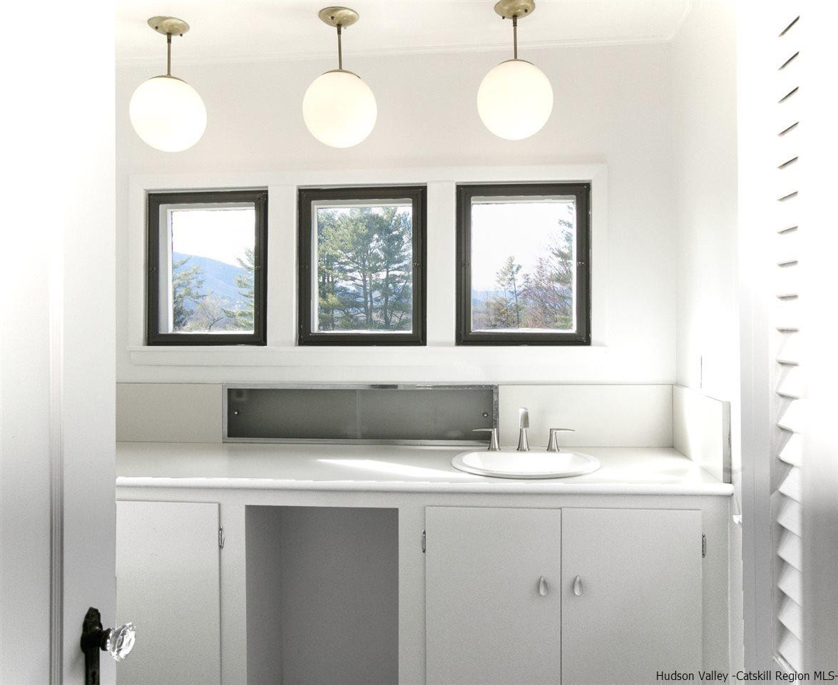 4701 Atwood Road, Unit ROUTE 213 Stone Ridge, NY 12484 - Photo 13 of 35 a bathroom with a sink and a mirror