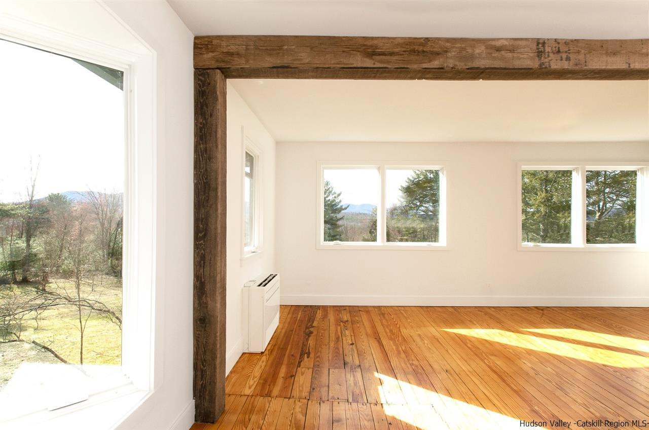 4701 Atwood Road, Unit ROUTE 213 Stone Ridge, NY 12484 - Photo 19 of 35 a view of a room with wooden floor and a window