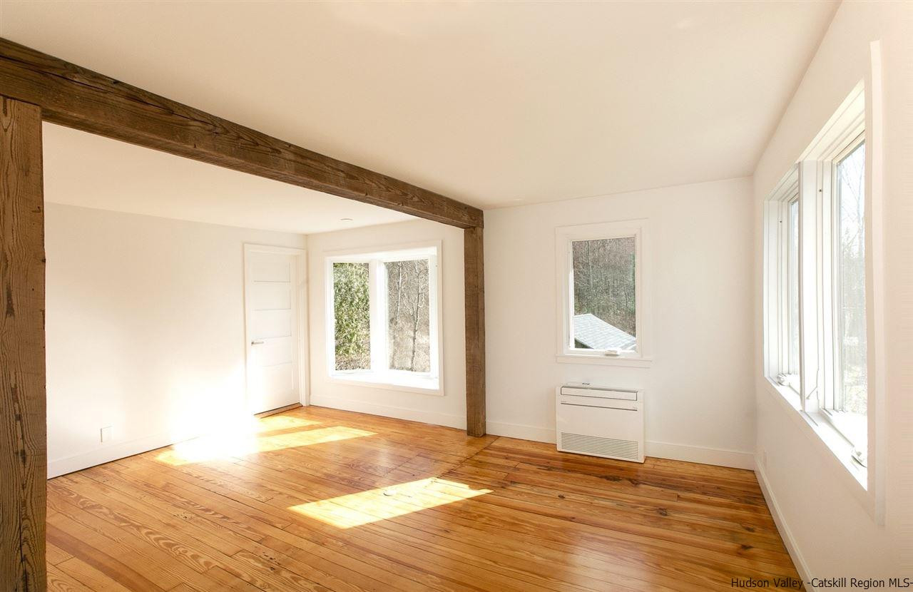 4701 Atwood Road, Unit ROUTE 213 Stone Ridge, NY 12484 - Photo 21 of 35 a view of an empty room with a window and wooden floor