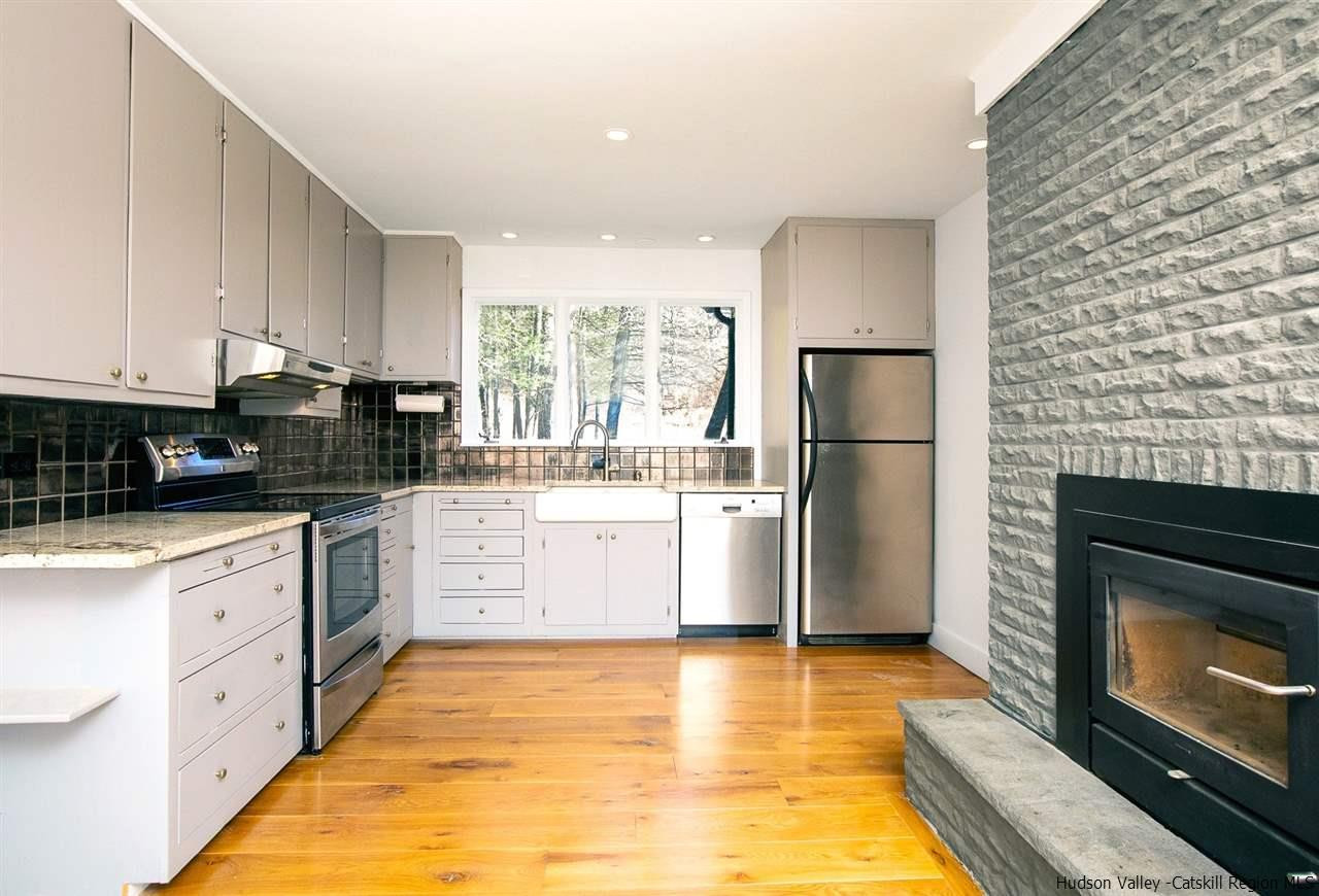 4701 Atwood Road, Unit ROUTE 213 Stone Ridge, NY 12484 - Photo 9 of 35 a kitchen with a stove a sink and a refrigerator