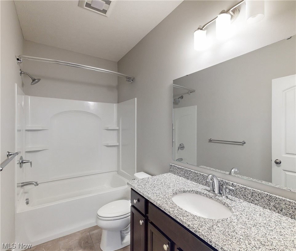5035 SOM Center Road Solon, OH 44139 - Photo 11 of 23 Full bathroom featuring tile floors, oversized vanity, shower / tub combination, and toilet