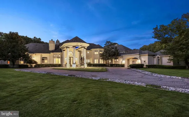 a view of a big house with a big yard