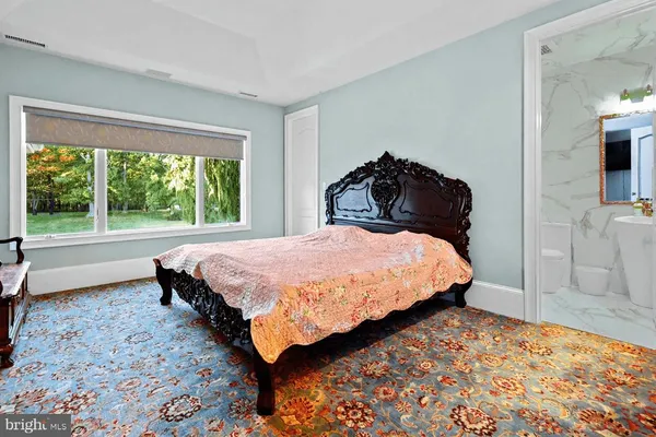 a bathroom with a toilet sink shower and mirror