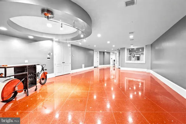 a view of a patio with a table chairs and a small yard