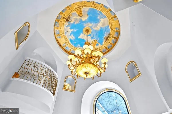 a front view of a house with outdoor seating