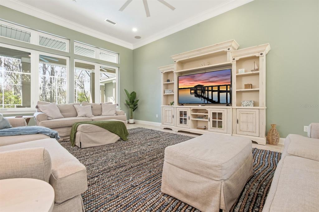 6595 Collier Road St. Augustine, FL 32092 - Photo 13 of 98 a living room with furniture and a flat screen tv