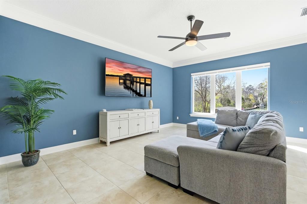 6595 Collier Road St. Augustine, FL 32092 - Photo 44 of 98 a living room with furniture and a flat screen tv