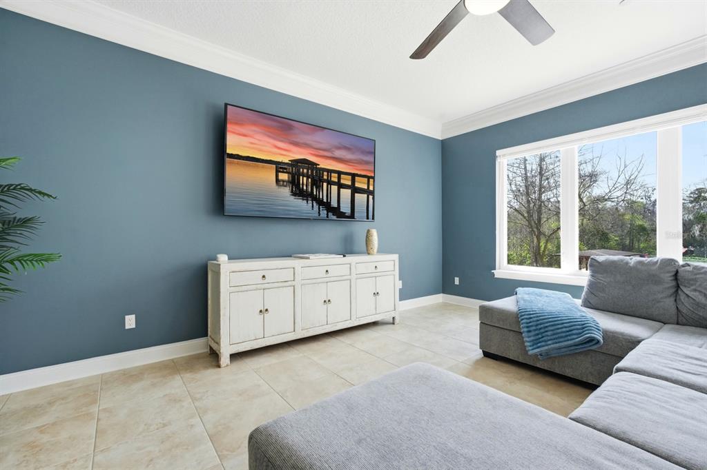 6595 Collier Road St. Augustine, FL 32092 - Photo 48 of 98 a living room with furniture and a flat screen tv