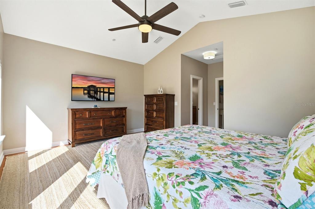 6595 Collier Road St. Augustine, FL 32092 - Photo 54 of 98 a bedroom with a bed and a dresser