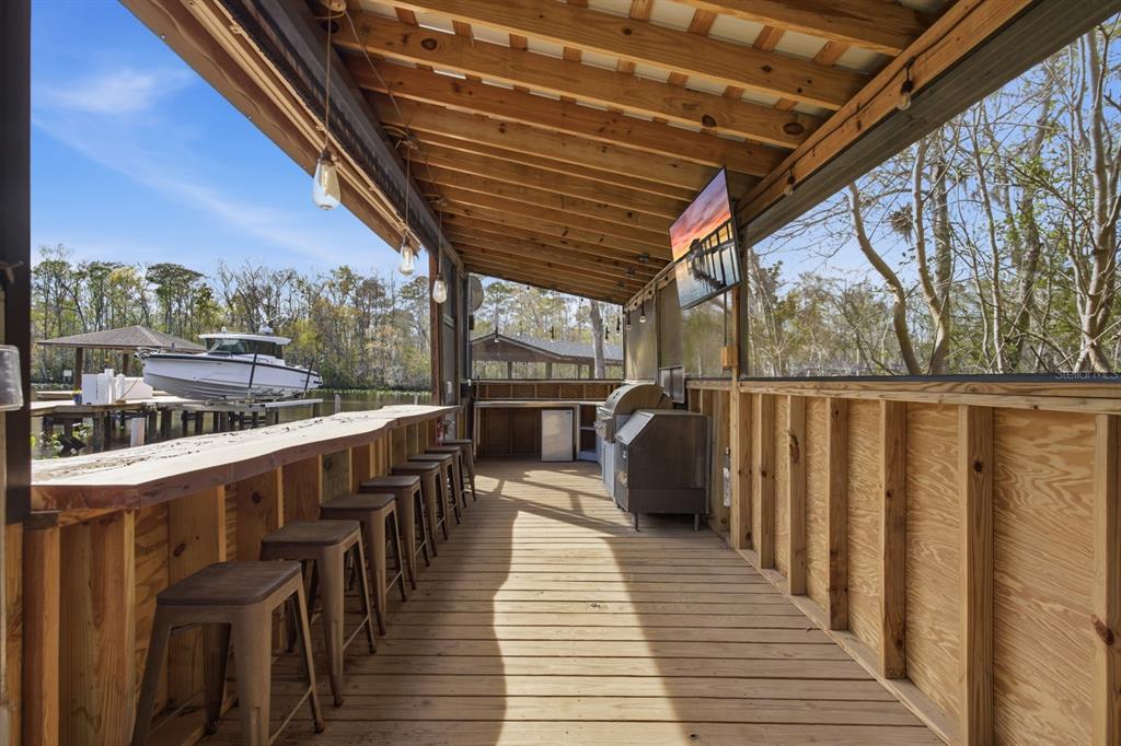 6595 Collier Road St. Augustine, FL 32092 - Photo 74 of 98 a view of a balcony with wooden floor