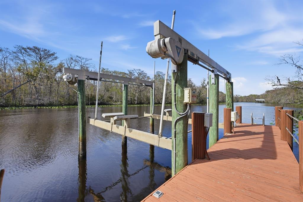 6595 Collier Road St. Augustine, FL 32092 - Photo 84 of 98 a view of a balcony with floor to ceiling windows and wooden fence